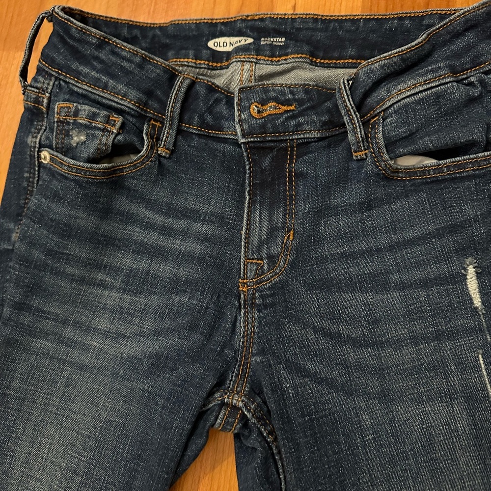 Distressed dark jeans